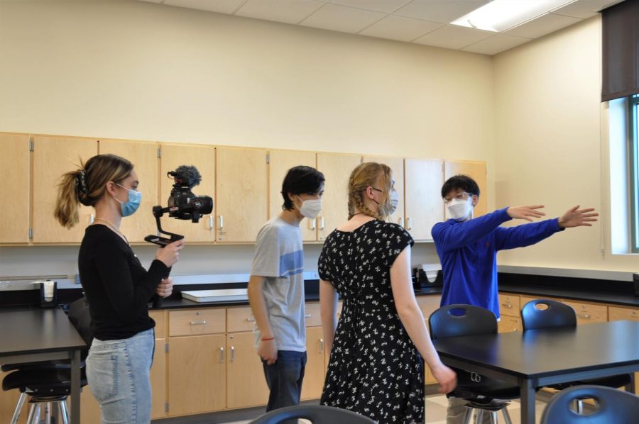 Joonbeom Heo is directing where he wants the shot to be taken with Danny Herz and Alexis Korb, while Kristina Bleszynski holds the camera. Photo Credit: Noele Louie