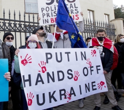 Georgian activists hold posters as they gather in support of Ukraine in front of the Ukrainian Embassy in Tbilisi, Georgia, Sunday, Jan. 23, 2022. The British government on Saturday accused Russia of seeking to replace Ukraine's government with a pro-Moscow administration, and said former Ukrainian lawmaker Yevheniy Murayev is being considered as a potential candidate. (AP Photo/Shakh Aivazov)