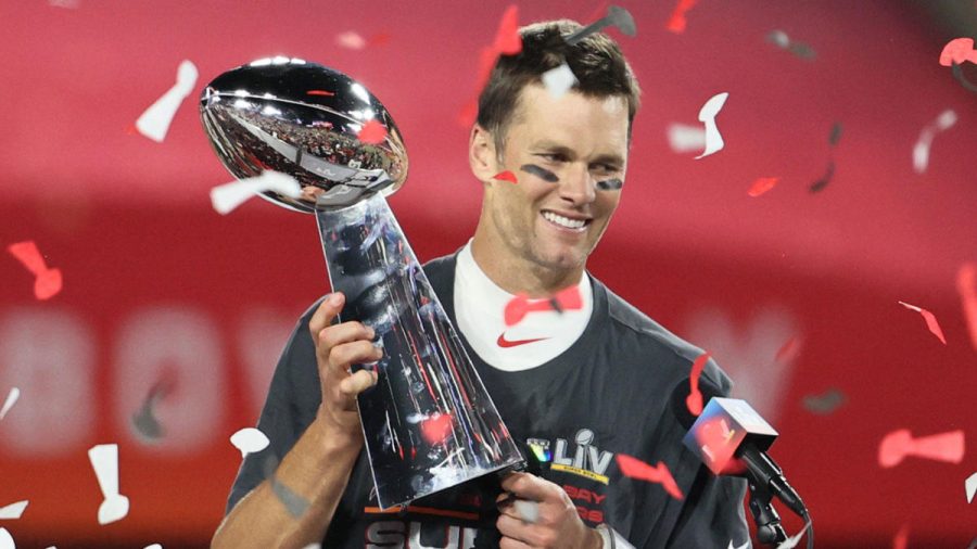 Tom+Brady+lifts+the+Lombardi+Trophy+after+defeating+the+Kansas+City+Chiefs+31-9+in+Super+Bowl+LV.%0A