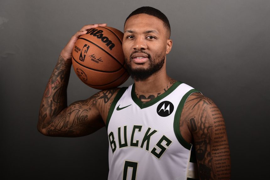 Damian Lillard wearing his Bucks Jersey for the first time.