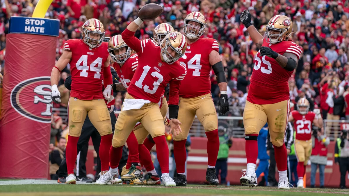 The 49ers Offense celebrates after a touchdown against Tampa Bay.