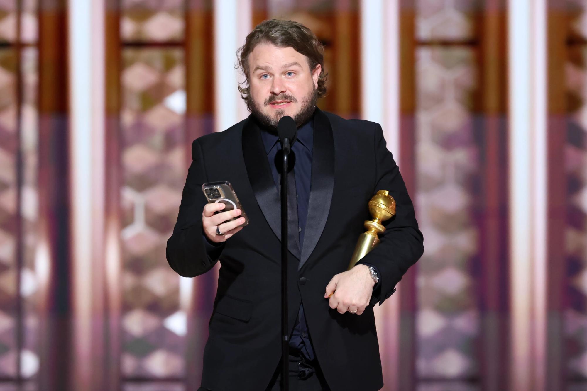 Brady Corbet, the director of The Brutalist, accepting the Golden Globe for Best Director.