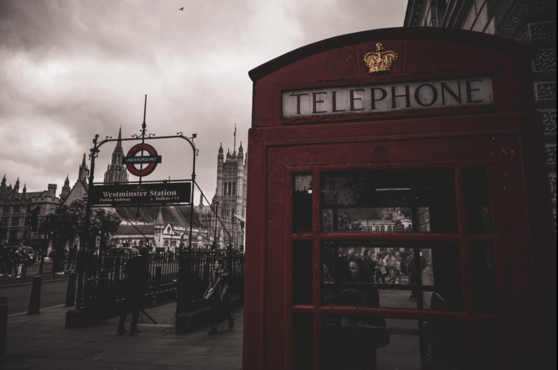 People hurry by in a weekday’s rush as an old telephone booth sits patiently under the eyes of tourists. I used a partial black-and-white mask to emphasize the red elements and add to the grit of the scene.