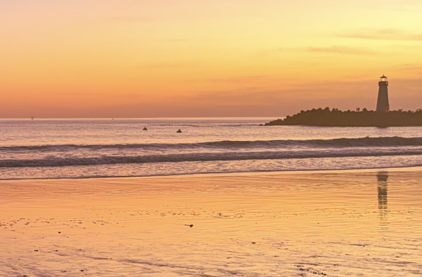 The orange-yellow tint provides comfort and joy to the eye by magnifying the glistening sun rays as they descend onto the horizon and the resting kayaks, making every object feel alive and peaceful.