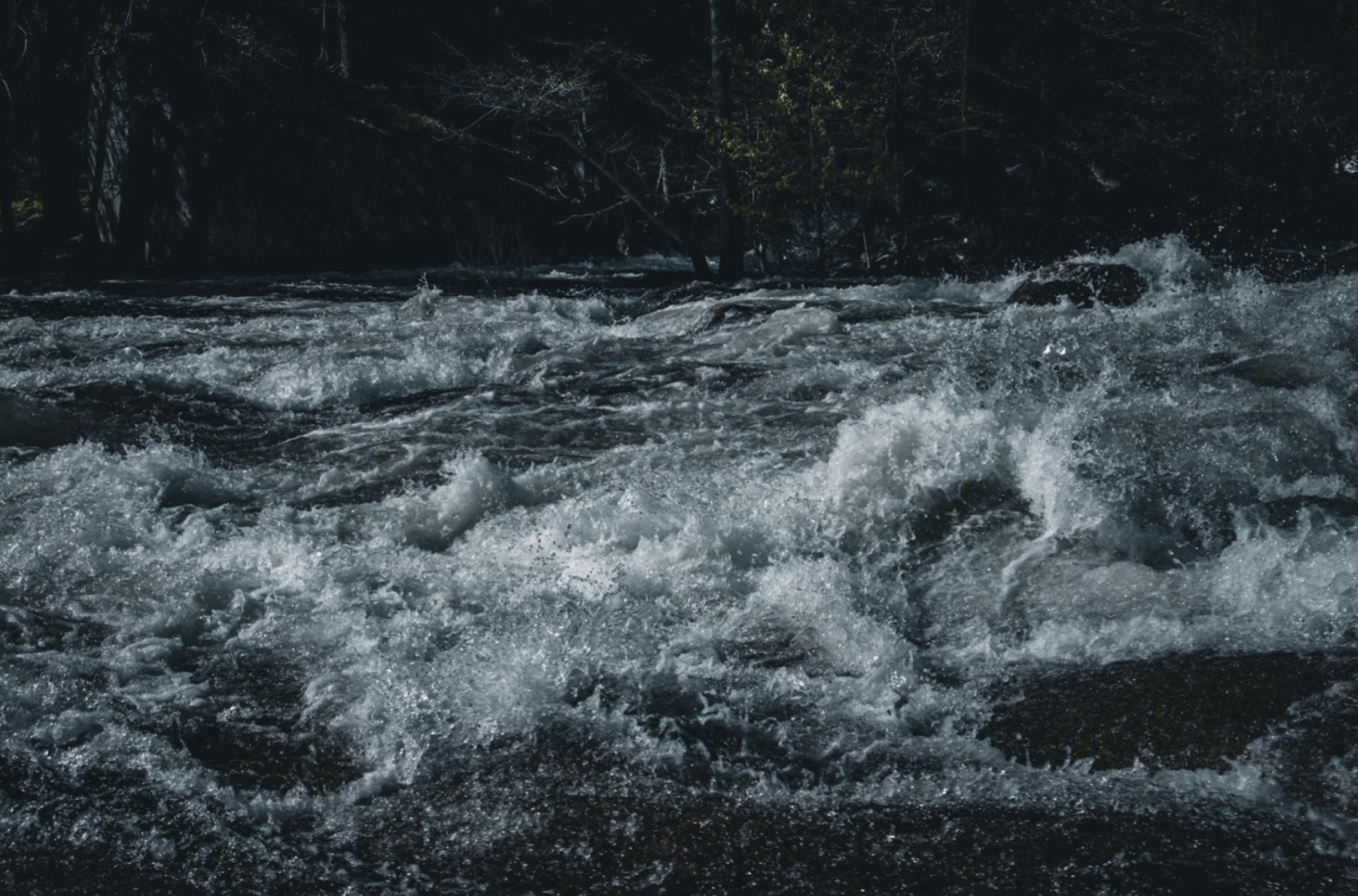 Powerful rapids lap and rip against carved granite stones on a cool afternoon in Yosemite. I applied a bluish, low-temperature tint in order to add to the refreshing and powerful nature of the water.